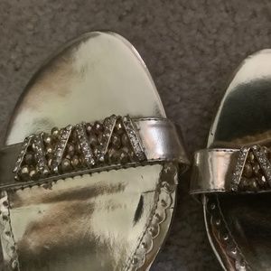 Brand new gold sandals in size 8. 3” inch heel